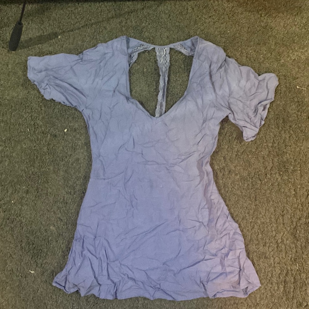Violet purple mini dress with an open back and lace detail